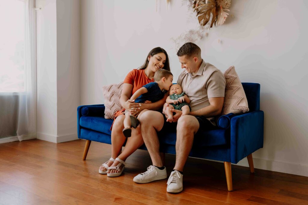 Family in Corvallis, Oregon studio brother kissing baby alt=""