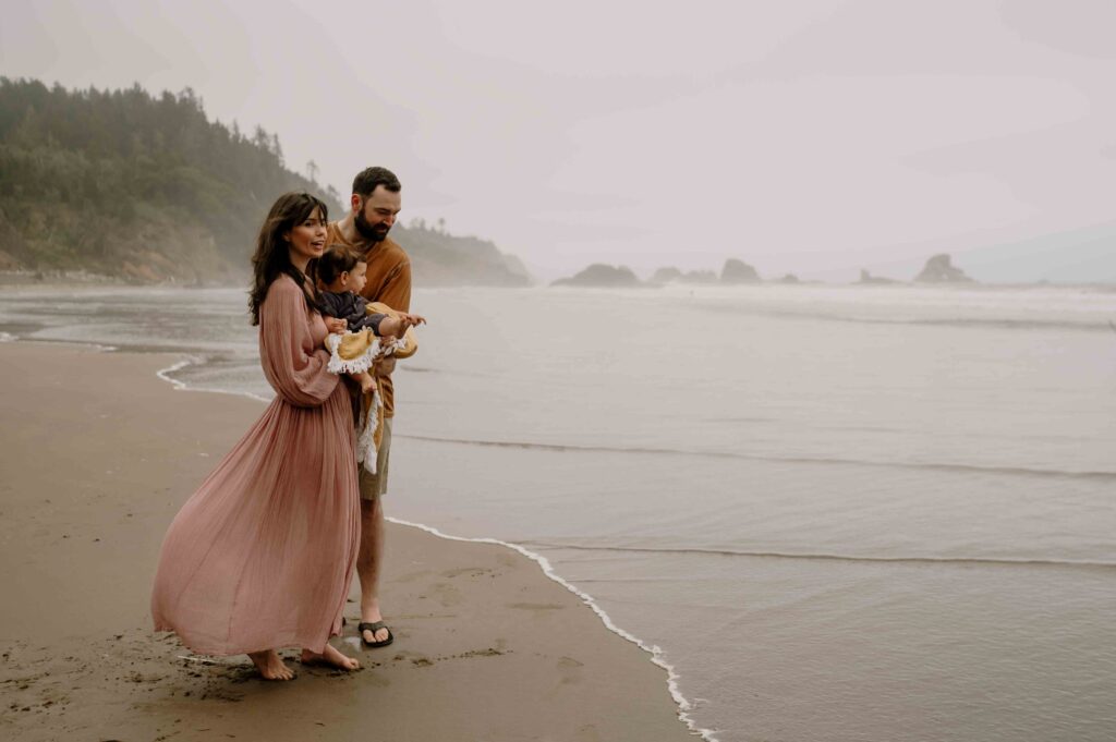 Mom and Dad looking out at ocean in Oregon.